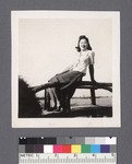 One woman #34 [seated on bridge] by Richard Shizuo Yoshikawa