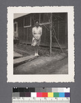 One woman #4 [in front of building]: Lily Y. Namimoto by Richard Shizuo Yoshikawa