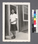One woman #40 [standing on porch]: Florence Kubota (Shimasaki)