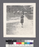 One woman #53 [on path; camp in background] by Richard Shizuo Yoshikawa