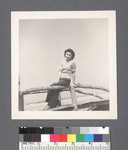 One woman #71 [seated on railing] by Richard Shizuo Yoshikawa