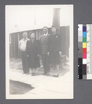 Two men, 2 women in front of building by Richard Shizuo Yoshikawa